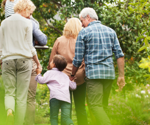 Generational family walking outside